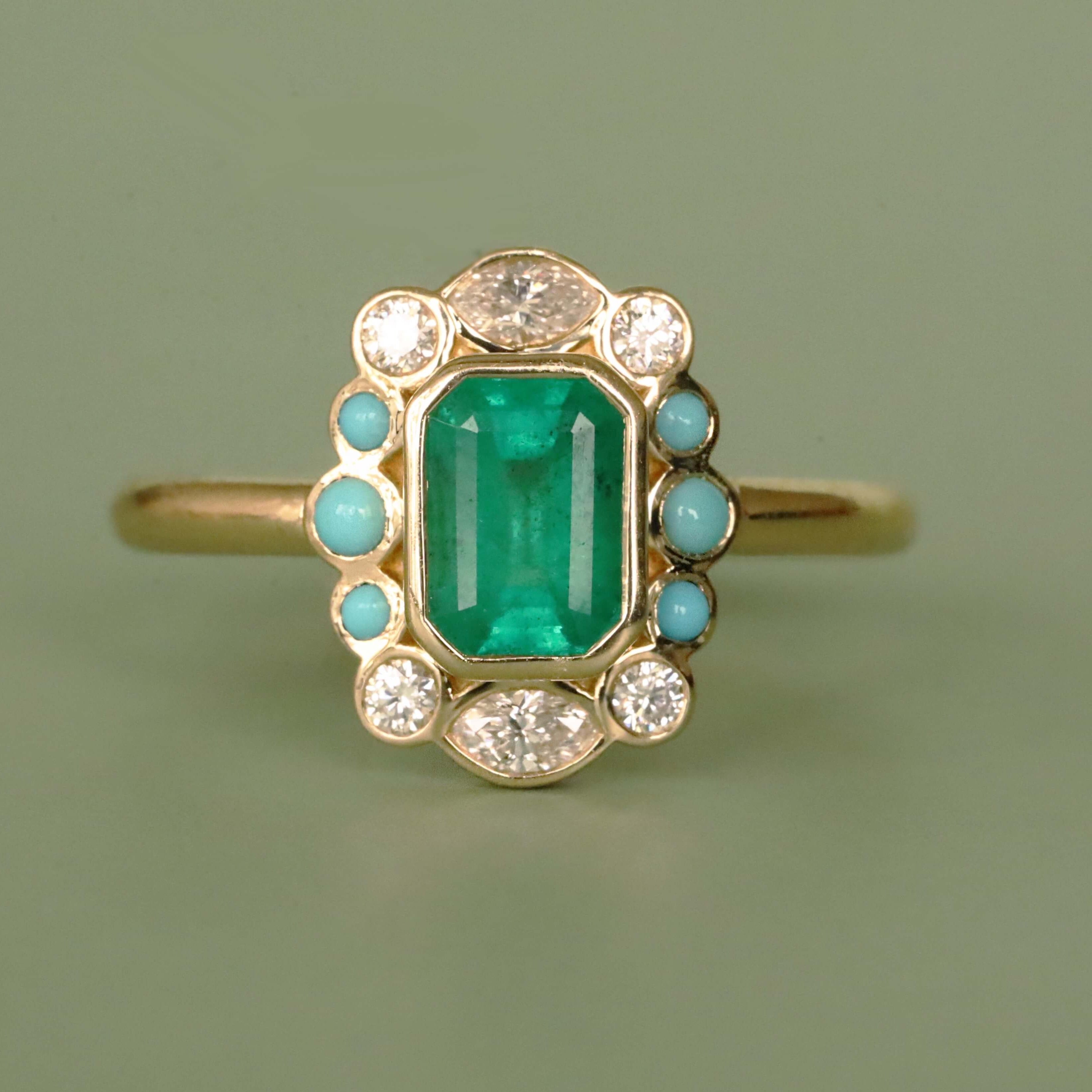 Flat lay of 1.04ct Emerald, Turquoise and Diamond Petals Ring