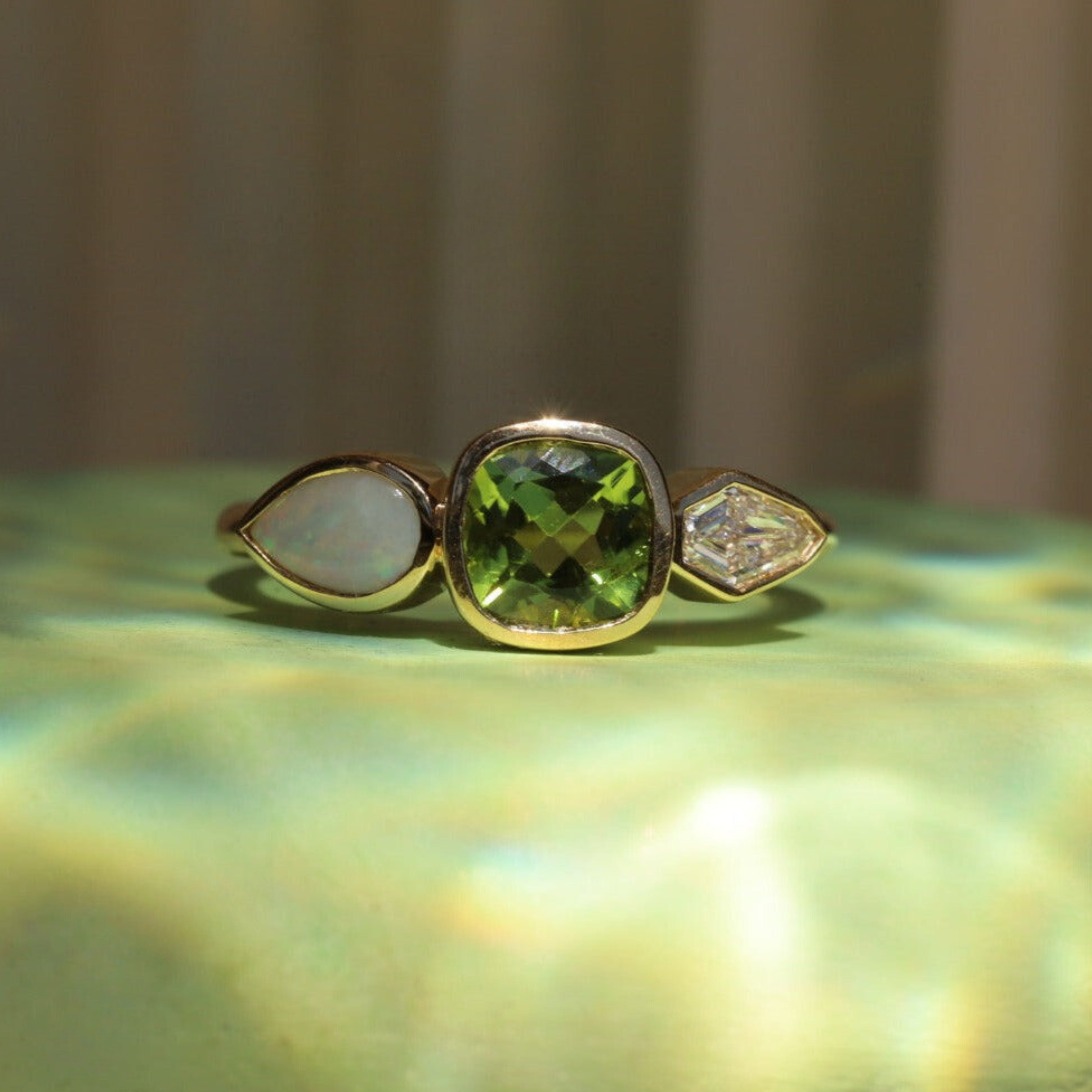 1.16ct Peridot, Diamond and Opal Linear Ring [flat lay]