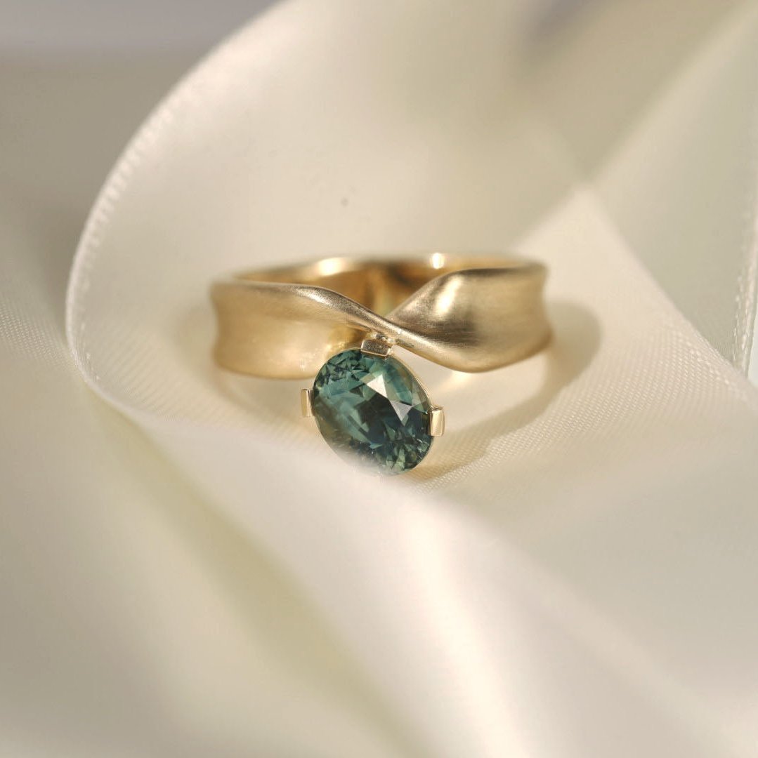 2.07ct Teal Oval Sapphire Twist Ring [flat lay]