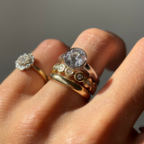 UGC photo - close up of White Diamond Billie Band stacked on hand with other Marrow Fine rings