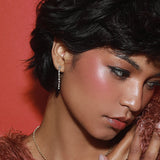 Close up of woman wearing Marrow Fine Diamond Cascading Earrings