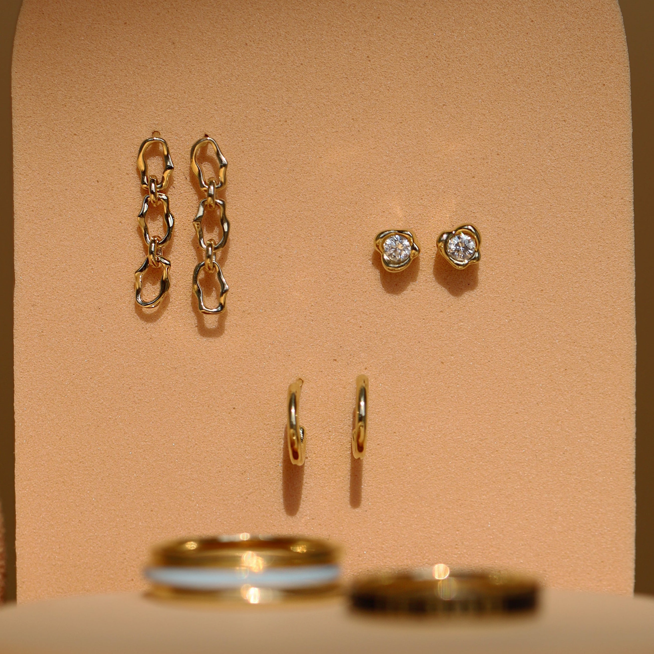 Flat lay of Marrow Fine earrings