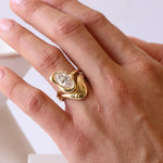 Close up of hand wearing Abstract Bezel One-Of-A-Kind White Diamond Ring and the Asymmetrical Sculpted Band