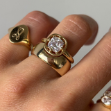 Close up of Everyday Selene Cigar Band stacked on hand with other Marrow Fine rings