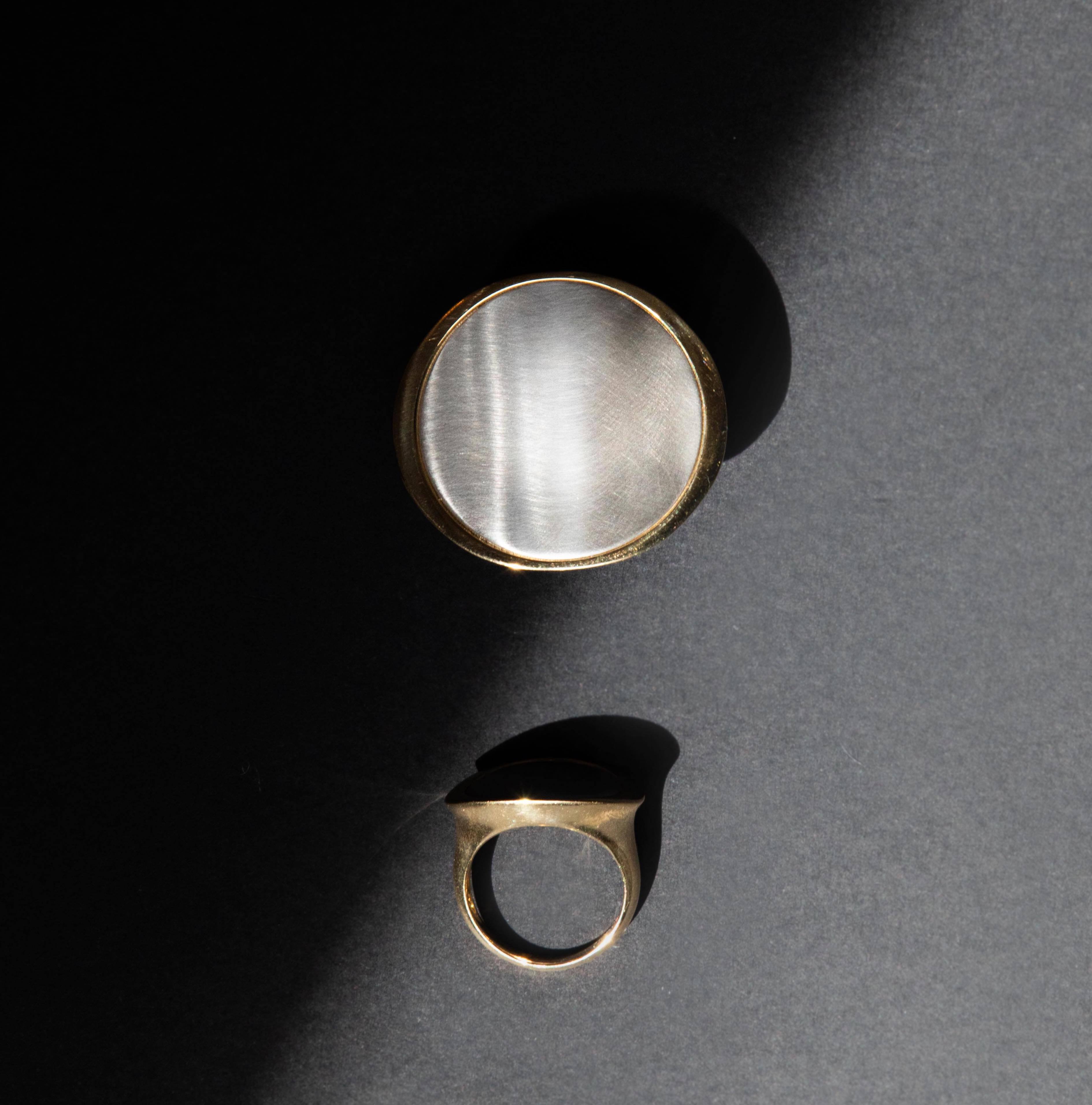 Flat lay of the Medium Kelly Statement Ring + The Large Kelly Statement Ring