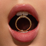 Close up of Inamorata Serpent Ring in mouth