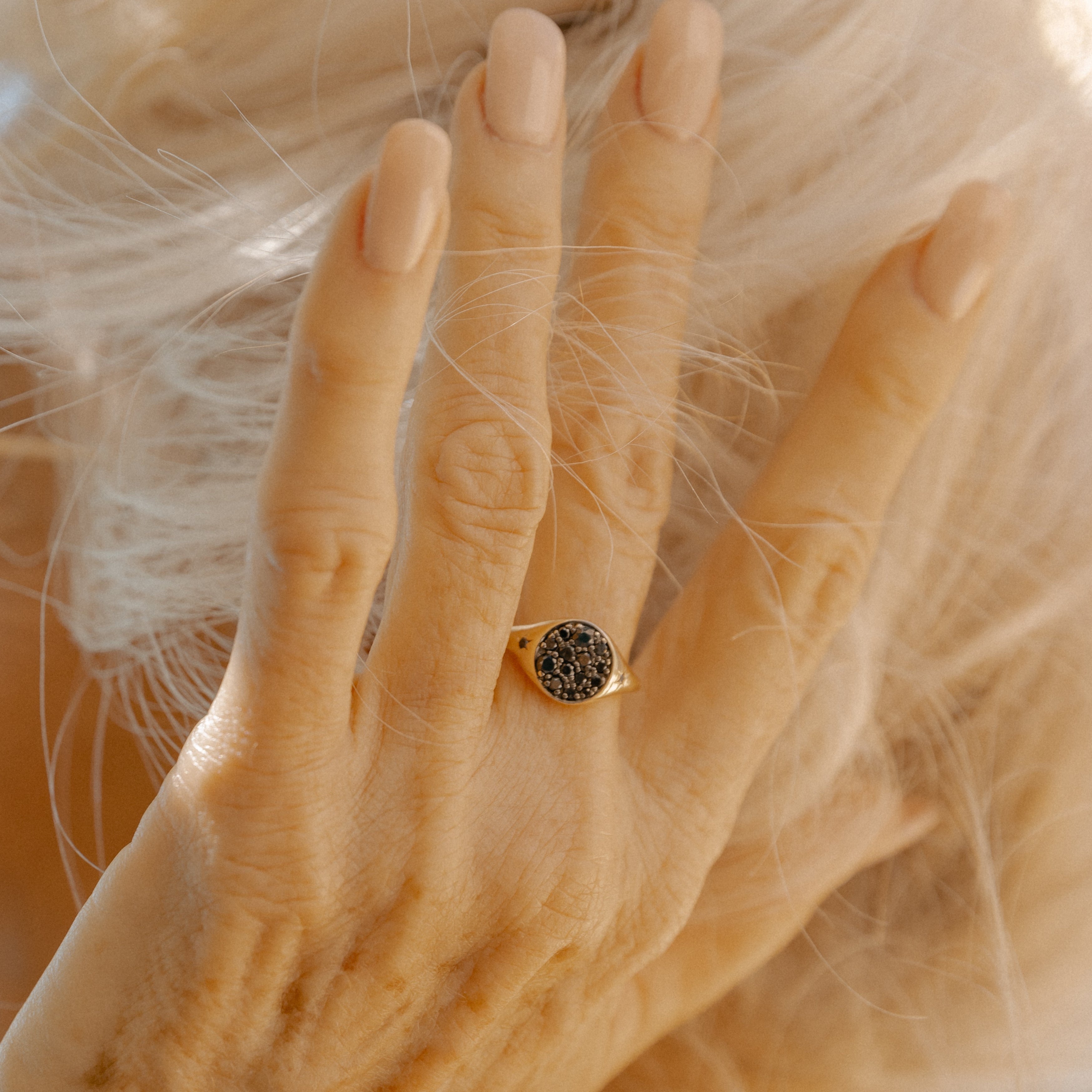 Close up of New Moon Signet Ring on hand