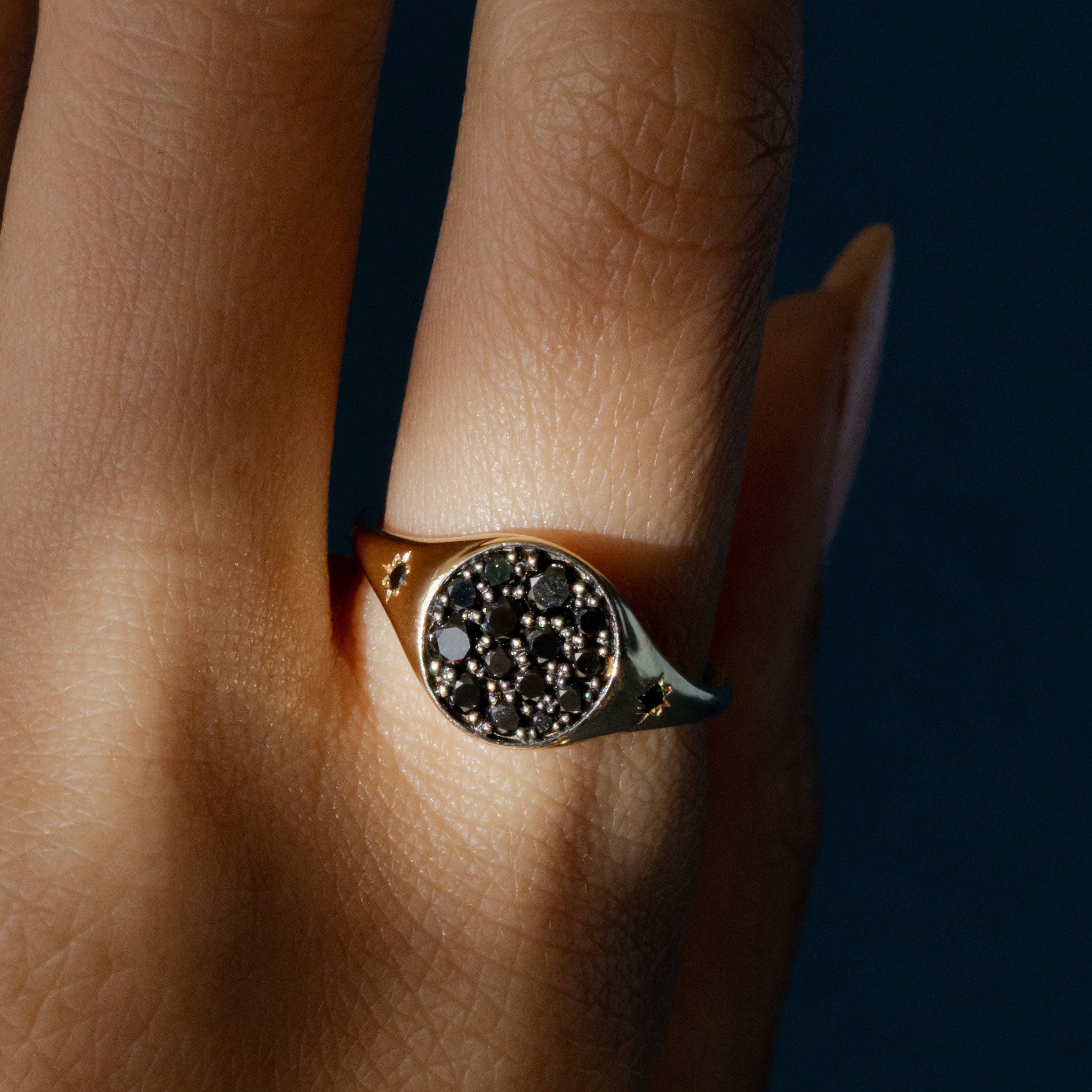 Close up of New Moon Signet Ring on hand