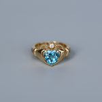 Image of the Marrow x Sammi 2.32ct Blue Topaz Sempre Ring on a blue background. 