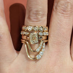 Close up of Marrow Fine Diamond bands stacked on hand