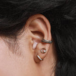 close up of woman's wear wearing multiple Marrow Fine earrings, including Everyday Ear Cuff