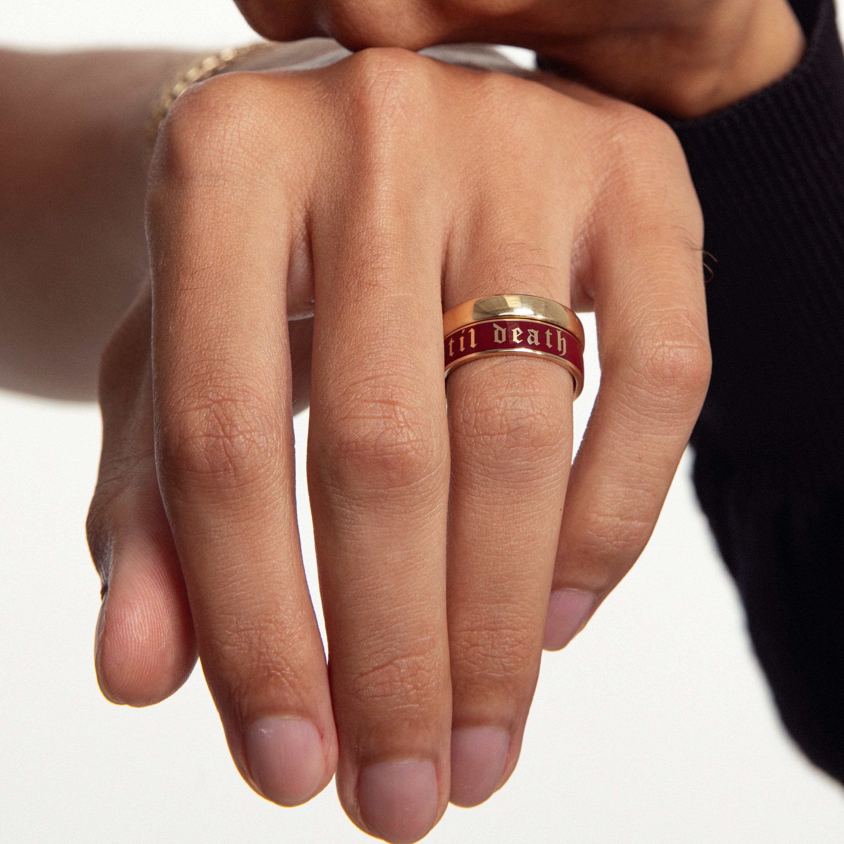 two stacked hands featuring multiple Marrow Fine rings